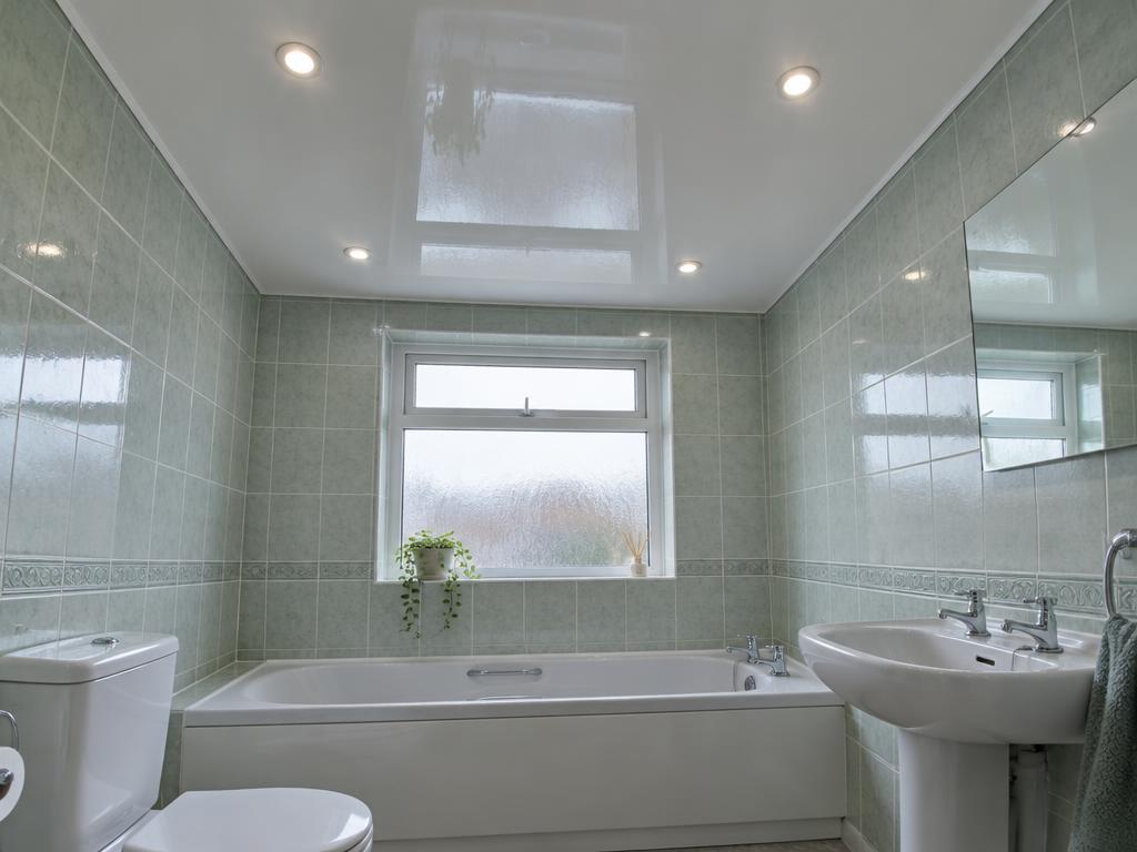 Gloss ceiling above a bath