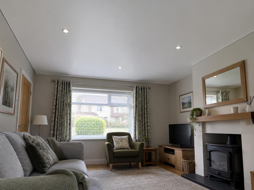 Smooth matt ceiling fitted over stipple in a living room